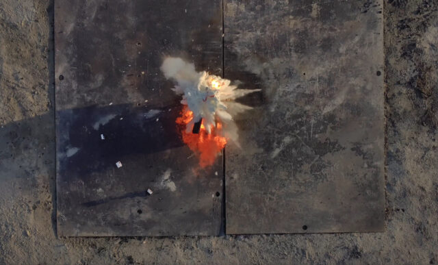 Fire retardant balls dropped by Anduril's Ghost-X drone explode on a fire in a test. The scene from above shows a c