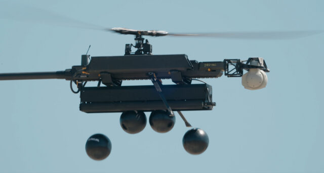 Anduril Industries Ghost-X drone dropping fire retardant balls in a test of fire suppression capability. The single-roto
